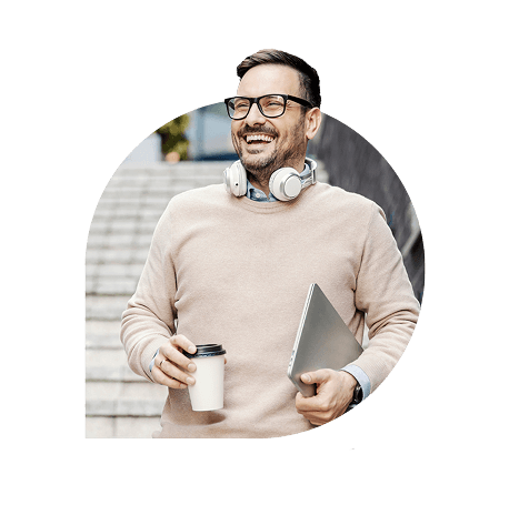 Man walking with laptop and coffee